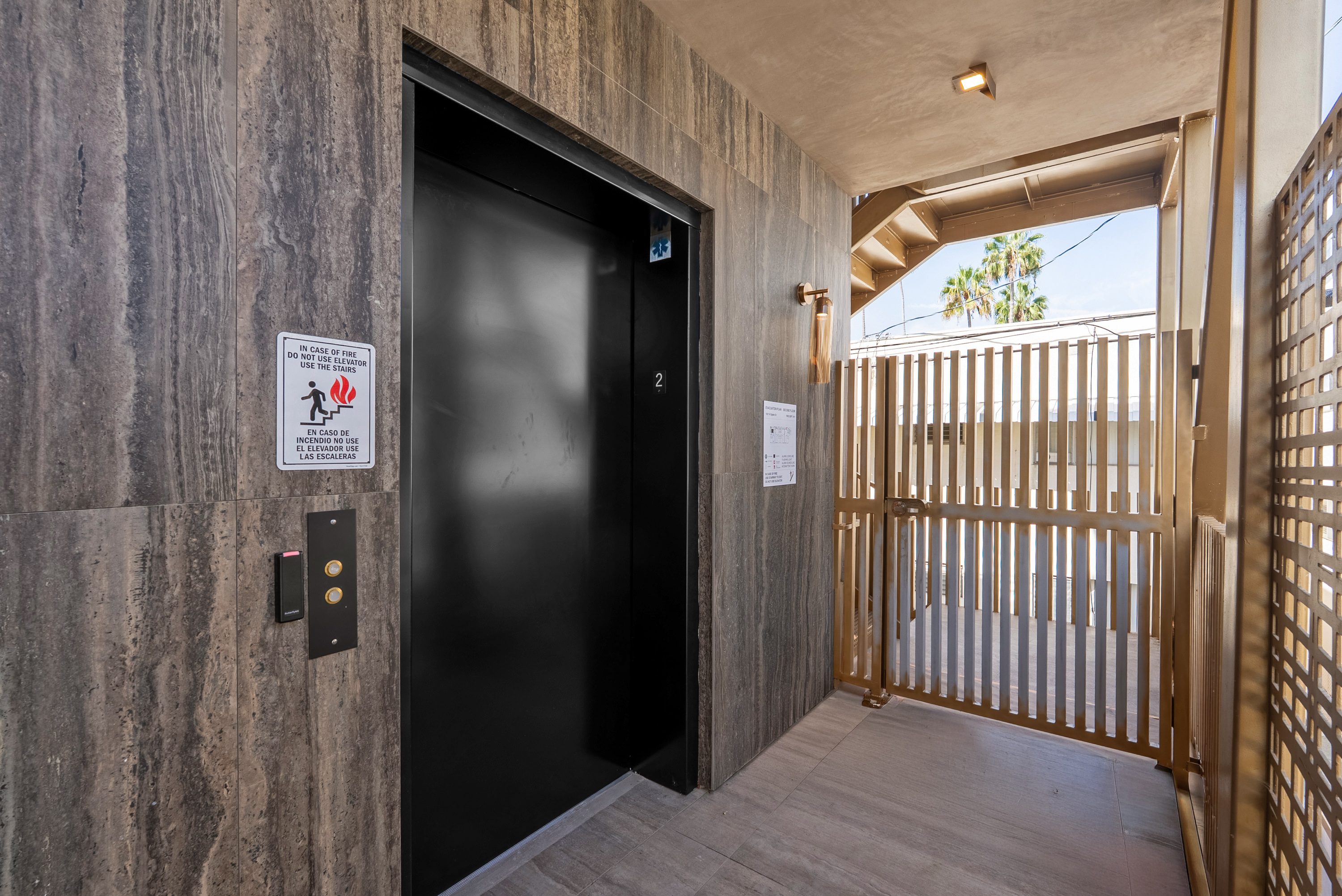 Elevator lobby with fob-controlled access behind the security gate